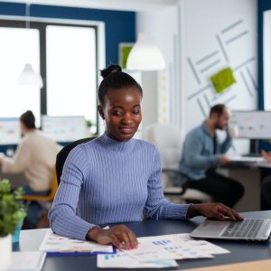 African in marketing corporate office working to finish deadline